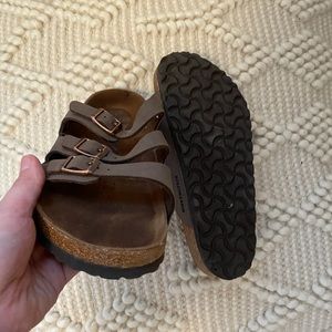 Brown three-strap Birkenstocks